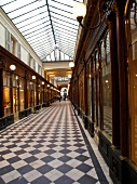 People passing through Gallery Vero Dodat in Paris, France