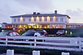 View of illuminated hotel Ferry in Munkmarsch, Sylt, Germany