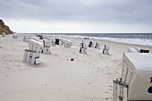 View of Westerland beach with hooded beach chairs in Sylt, Germany
