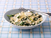 Spinach barley risotto in serving dish
