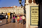 People walking near Confeitaria Nacional and pastry shop in Lisbon, Portugal