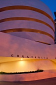 Exterior of Solomon R. Guggenheim Museum at night in New York, USA