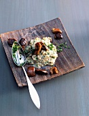 Porcini mushroom risotto on wooden tray