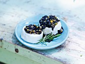 Goat's cream cheese topped with olives