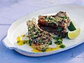 Lamb chops with yogurt and almond marinade in serving dish