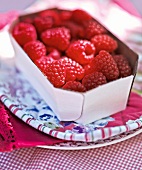 Close-up of bowl of raspberries in summer kitchen