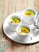 Chilled cucumber soup with ginger bread crust in cups