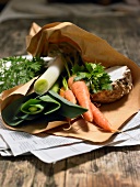 Close-up of green vegetables in paper bag