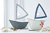 Lanterns in the shape of boats with maritime accessories