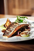 Loup de Mer with fig and fennel on plate