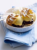 Profiteroles filled with ice cream and blueberries