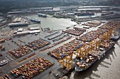 Elevated view of cargo containers and boat at port in Bremerhaven, Bremen, Germany