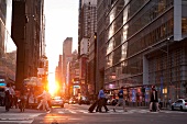 People at Fifth Avenue at 42nd Street at sunset, New York, USA