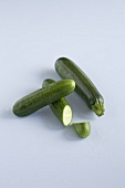 Zucchini and cucumber on white background