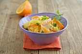 Ribbon pasta with carrot and parsley in bowl