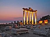 Illuminated Temple of Apollo ruins at night in Side, Turkey