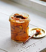 Jar of Indian style homemade pickled carrots in oil