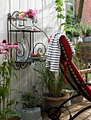 Petite iron shelf and deck chair on balcony