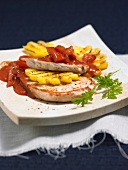 Close-up of tomato steak with pineapple on plate