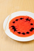 Dessert garnished with sauce in a pattern 