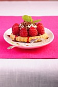 Raspberry tartlets on plate