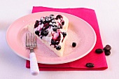Cake with cream and blueberry compote on plate