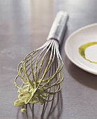 Close-up of whisk with sauce