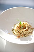 Close-up of thick spaghetti with bottarga in bowl