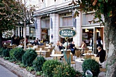 People sitting at Bazaar Terrasse cafe in Elisabethkai promenade, Salzburg, Austria