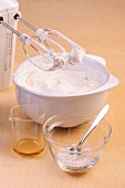 Blended egg whites and cream in bowl while preparing mini pavlovas, step 1