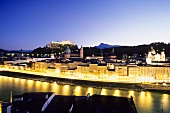 Elevated view of illuminated Rudolfskai and river Salzach at night, Salzburg, Austria