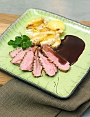 Duck breast with birnengratin in serving dish