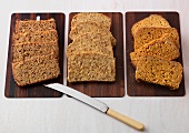 Quinoa whole grain bread, millet bread and olive oil ciabatta bread on plates