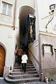 People climbing up to Capuchin stone alley, Salzburg, Austria