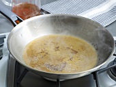 Pan drippings being boiled in frying pan, step 2