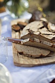 Slice of brown bread on wooden platform