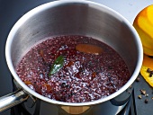 Mixture being boiled in pan for preparation of bound wild jus, step 1