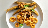 Close-up of fried squid and anchovies on plate
