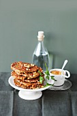 Carrot fritters with nuts and a soya dip with curry