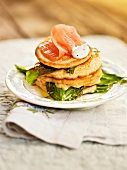 Close-up of wild garlic blini with smoked salmon and sour cream on plate