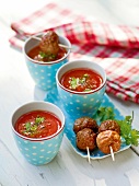 Tomato soup with meatballs in skewers, garden kitchen