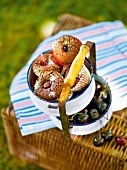 Chocolate cherry muffins with thyme in container, garden kitchen