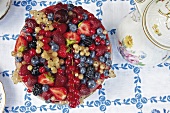 Berry yogurt mousse cake on table