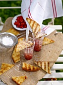 Sponge cake with strawberries on wooden board