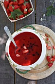 Cold berry soup with strawberries in bowl