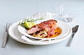 Chicken breast and ham on plate