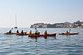 Paddlers on boat in Adriatic Sea, Dubrovnik, Croatia