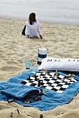 Chessboard printed bath towel on beach