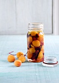 Close-up of apricot brandy in jar
