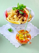 Pasta salad with peppers and feta dressing in bowl